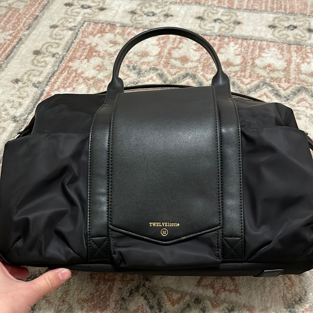 Twelve little black nylon peek-a-boo bag